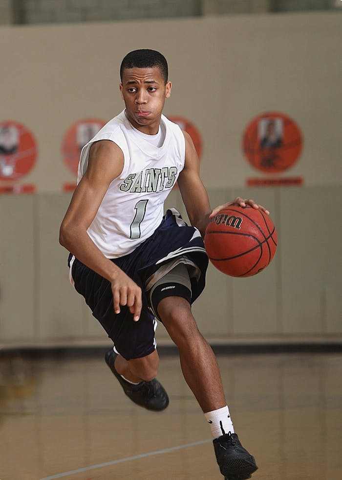 The Art of Drawing Readers In: Your attractive post title goes here Energetic basketball player in mid-dribble on an indoor court.